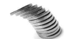 a stack of coins toppling over